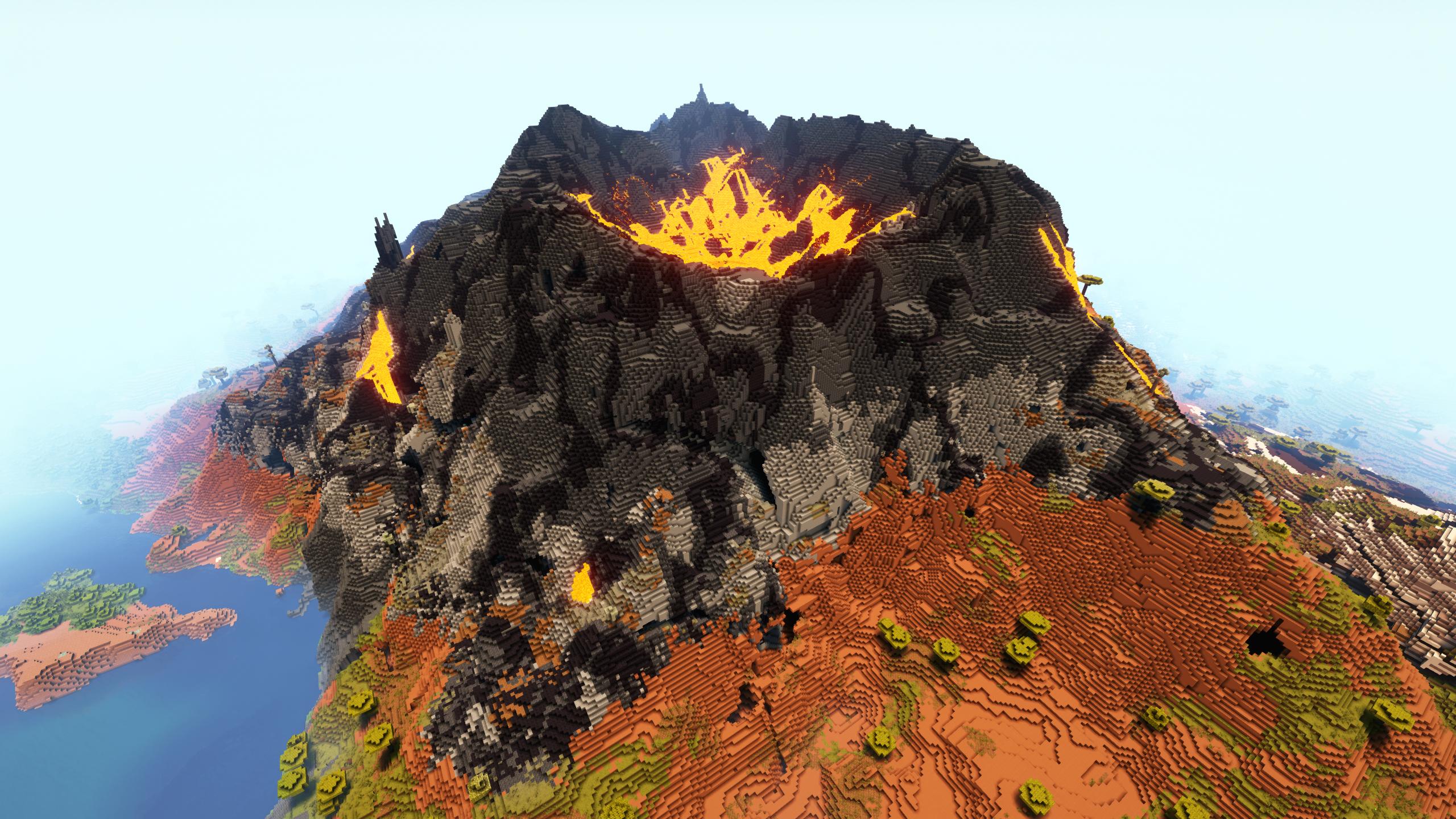 Paisaje volcánico de Minecraft con montañas y ríos de lava